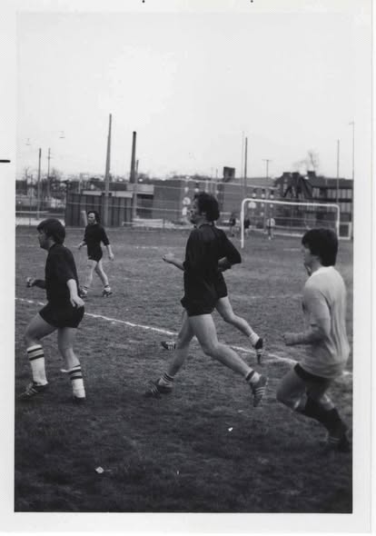 Black and white photograph of Mizzou players running during a match in the early 1970s