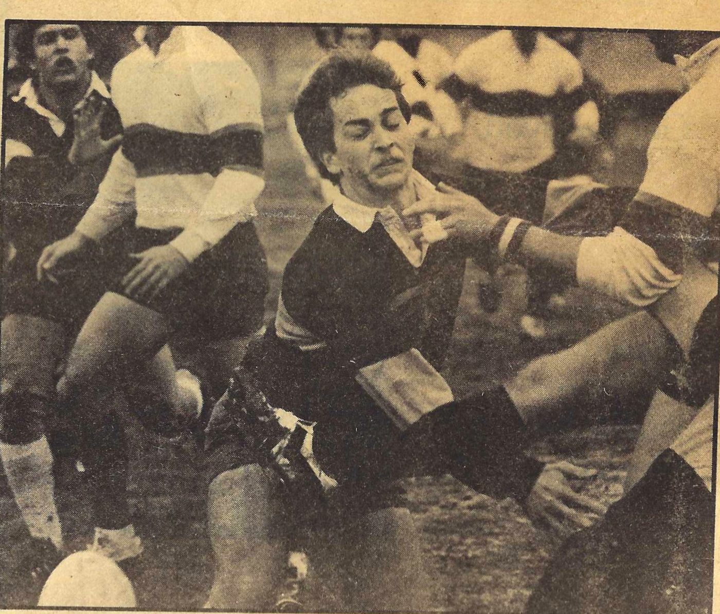 John Holdmeyer grimaces after taking a foot to the midsection on a blocked kick against Springfield in 1984