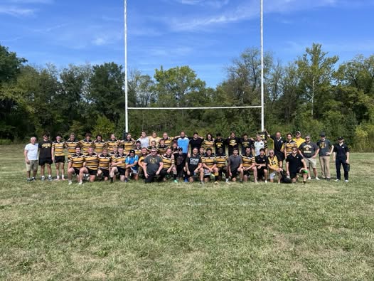 Alumni gathered on the pitch at the Mizzou Rugby alumni reunion match in 2011