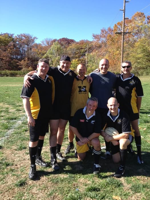 Seven Mizzou rugby alumni of the early 1990s posed on the pitch at the 2012 alumni reunion match