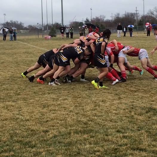 Mizzou forwards pack down in a scrum against a side in red during the 2015-16 season
