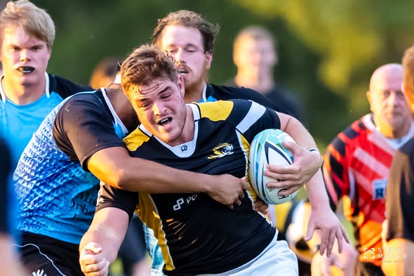 A Mizzou ball carrier is held up by Columbia Outlaws defenders in September 2022
