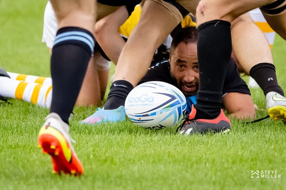 Players compete for the ball on the ground during Mizzou versus Columbia Outlaws, September 2022