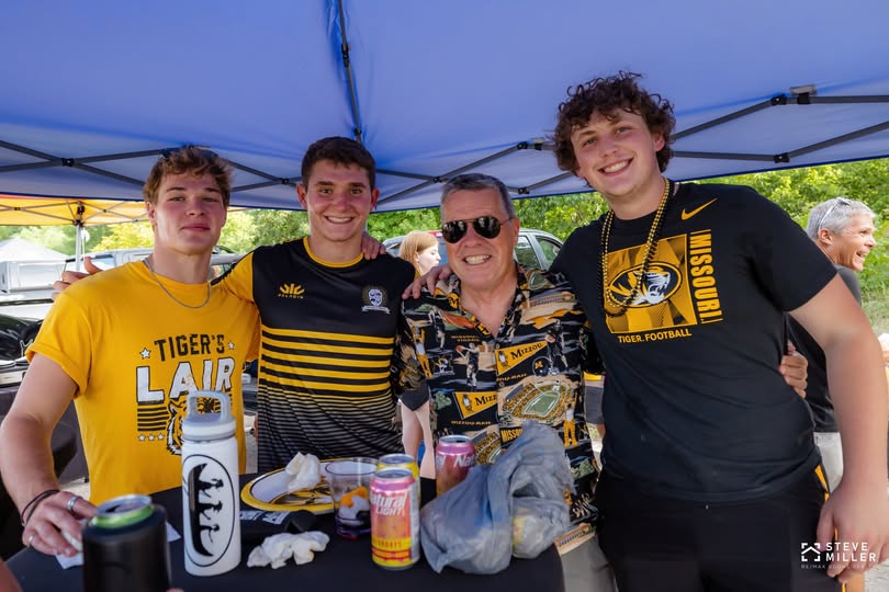 Mizzou ruggers and their coach at a tailgate before the football home opener in September 2022