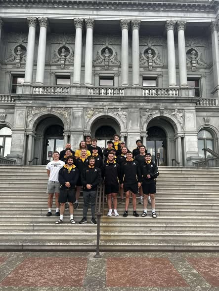 Mizzou players photographed on the steps of a civic building during a spring 2023 road trip