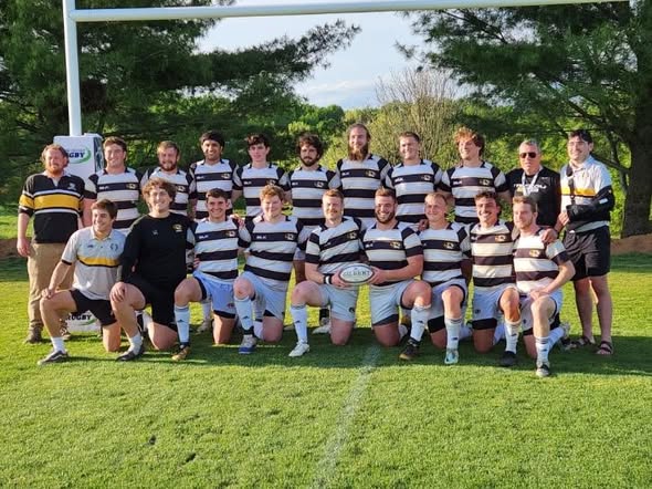 The Mizzou squad lined up in hooped jerseys on the pitch in spring 2023