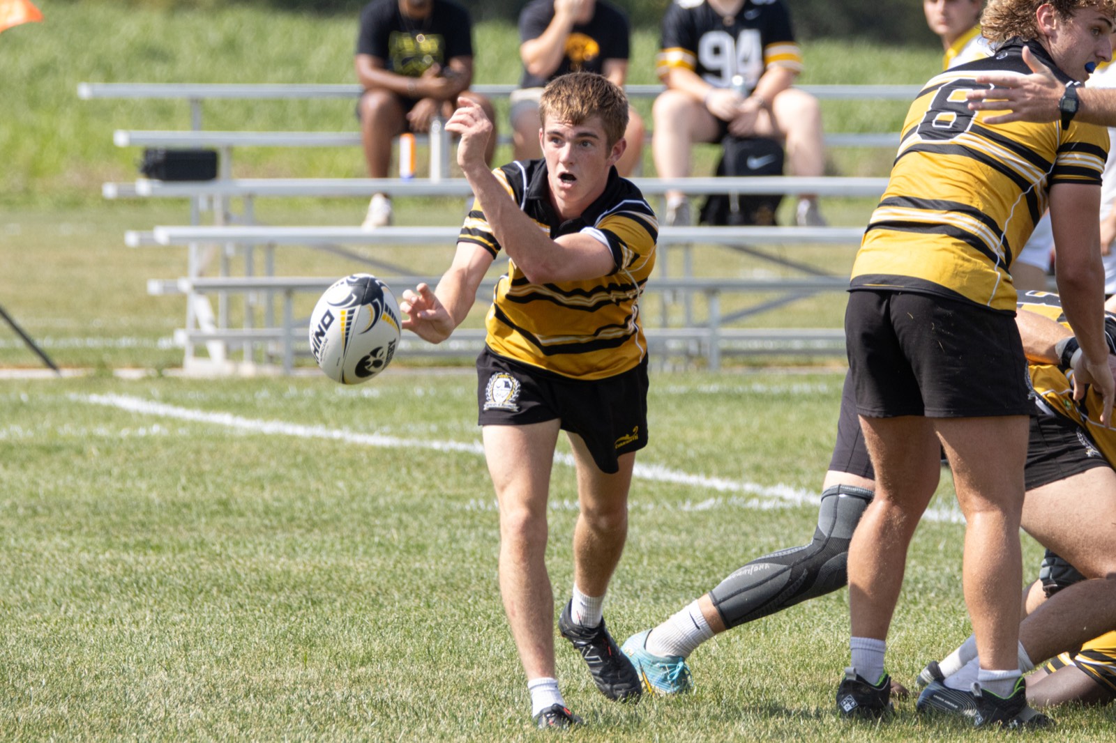 A Mizzou scrum-half spins the ball away from the base of a ruck against Iowa