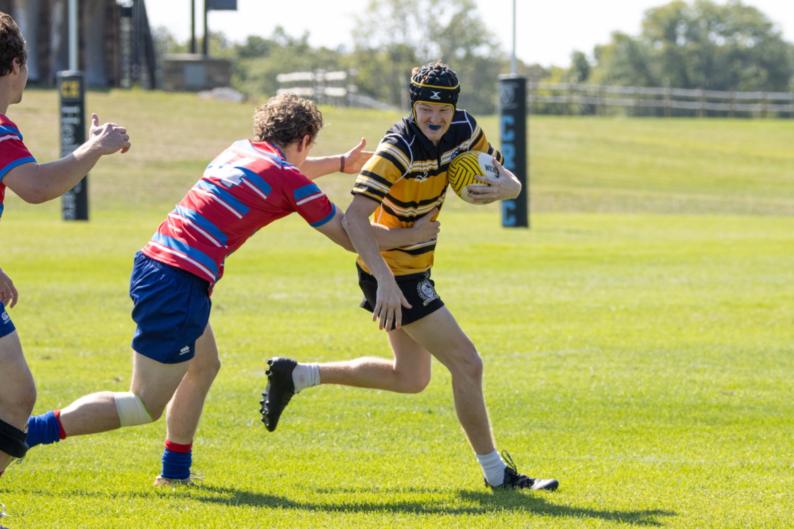 A Mizzou player steps away from a diving Kansas defender