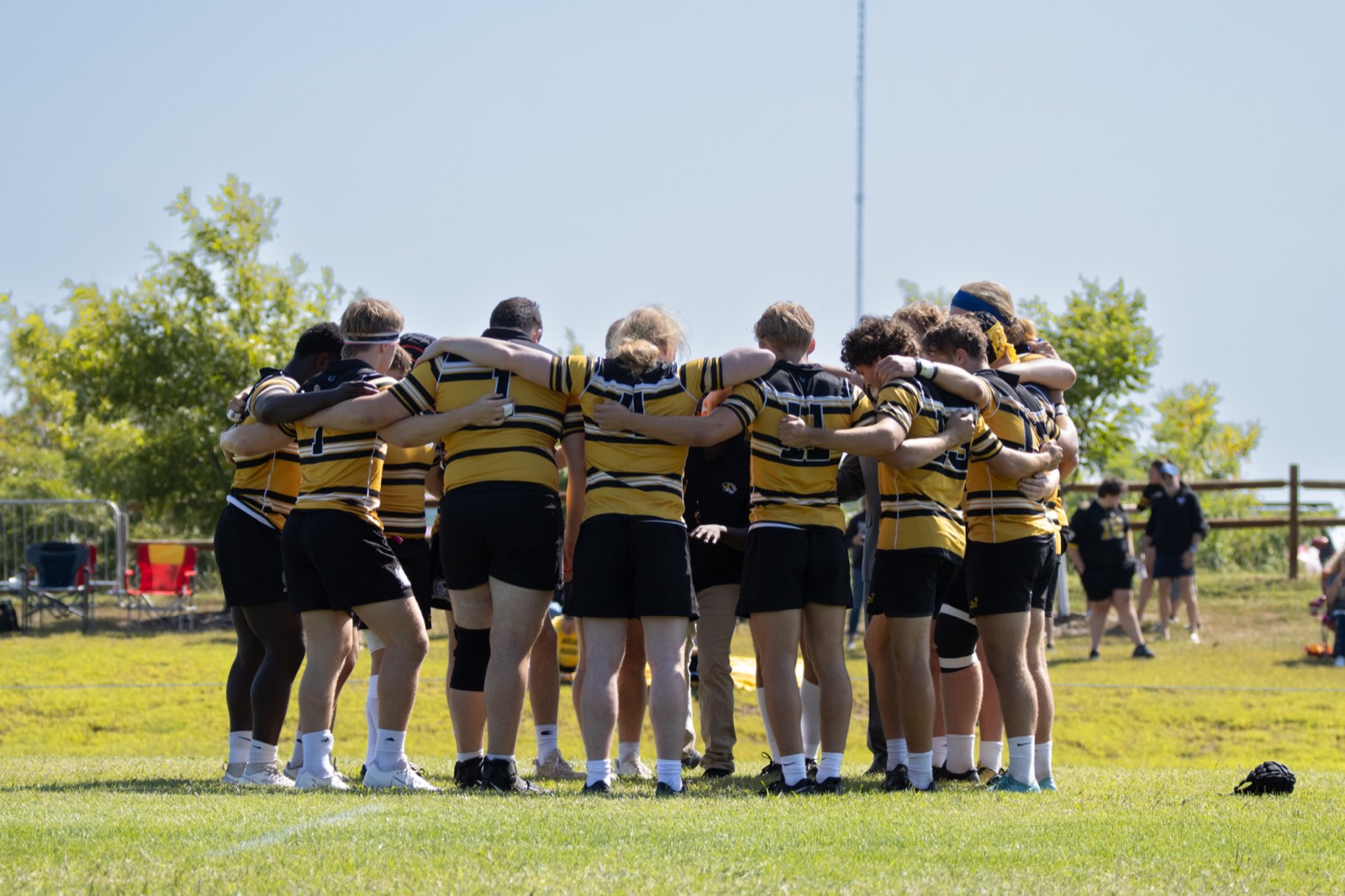 The Mizzou squad in a tight huddle before kick-off against Kansas