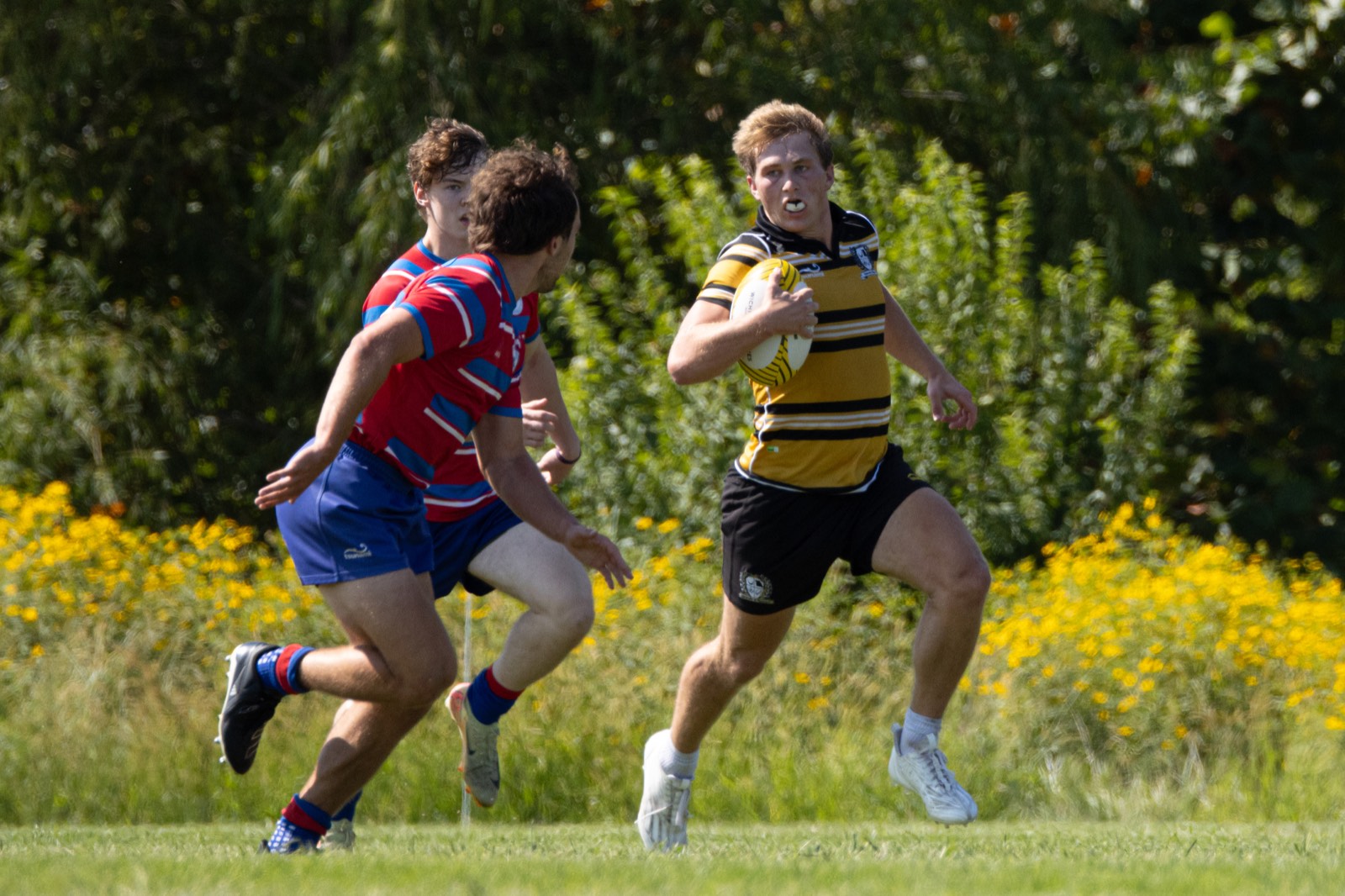 Mizzou rugby player running with the ball — Fall 2026 schedule