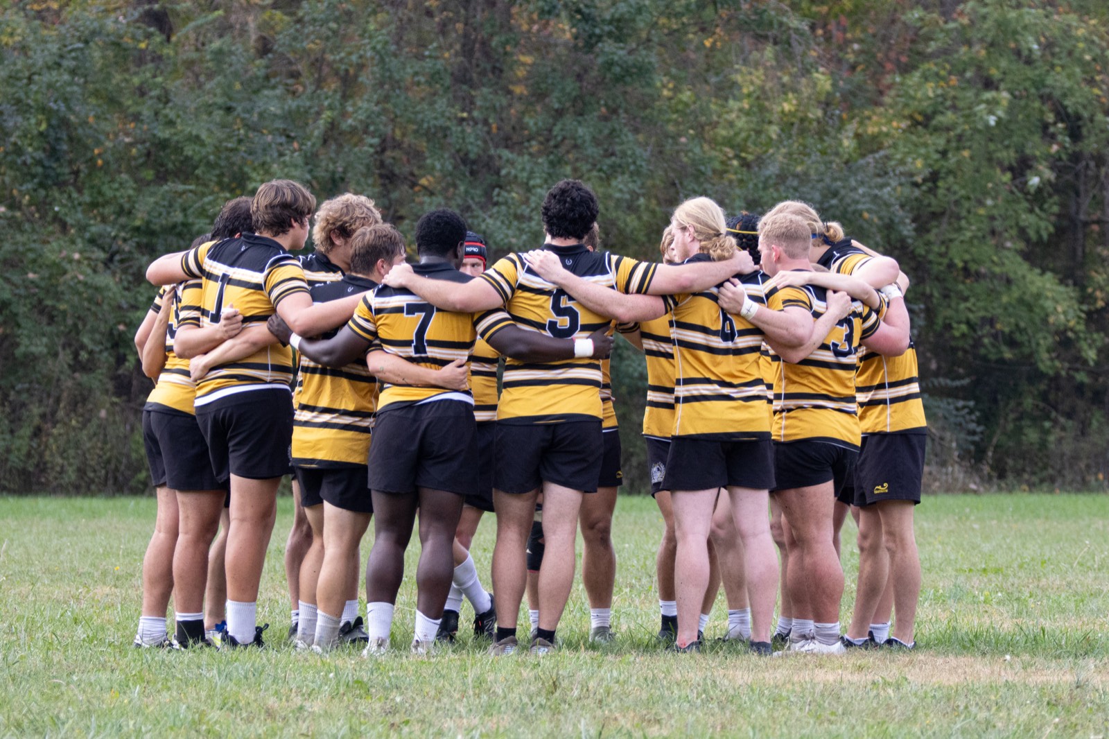 Mizzou rugby team huddle — Alumni Weekend 2026