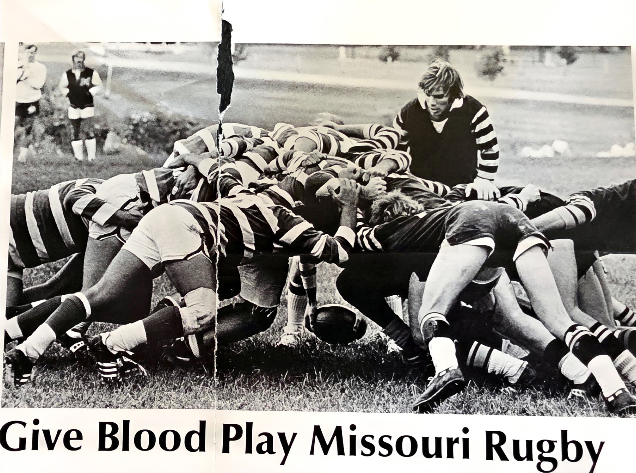 Give Blood Play Missouri Rugby recruiting poster with a black-and-white scrum photo