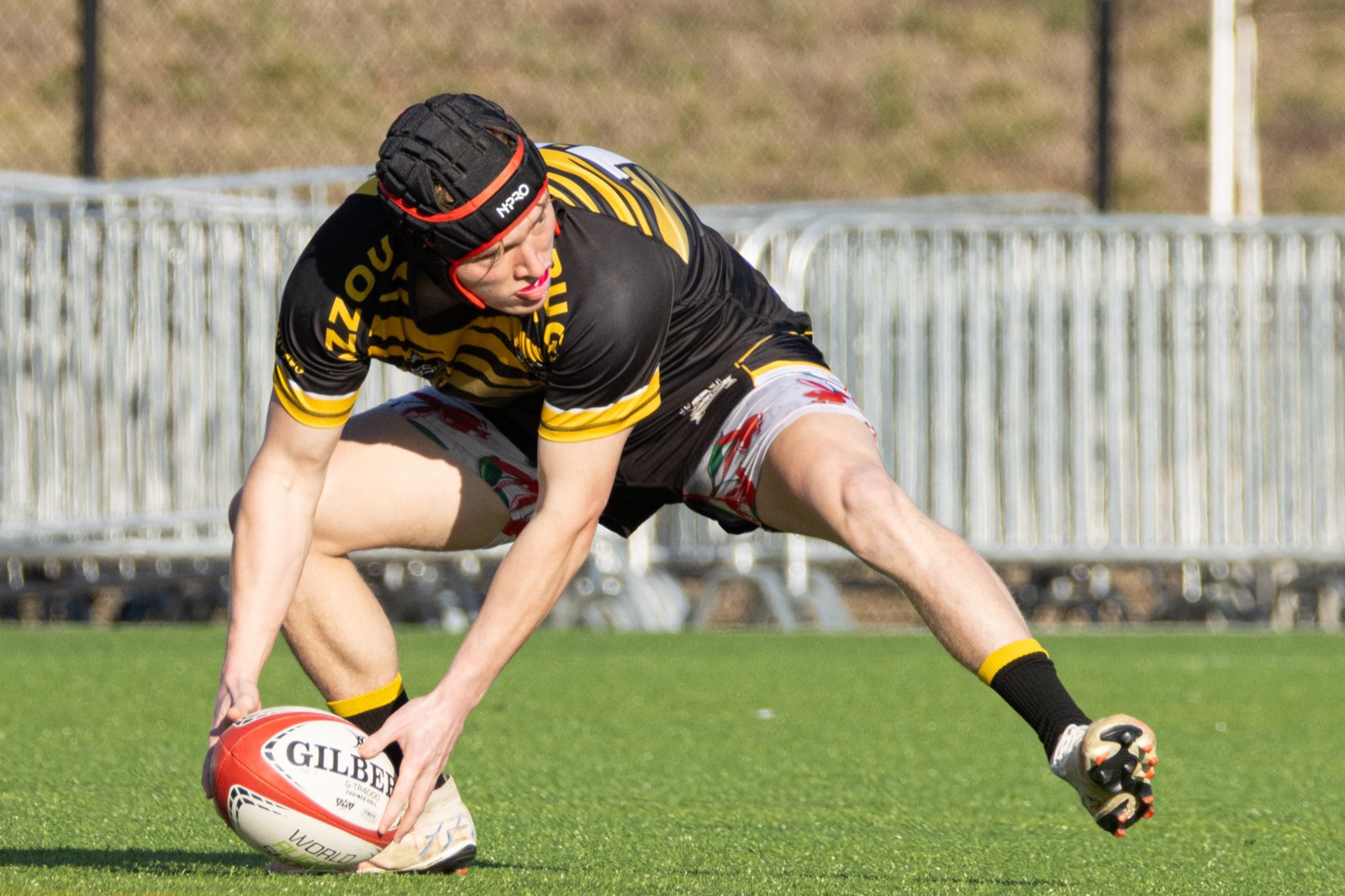 A Mizzou player dives to ground the ball for a try