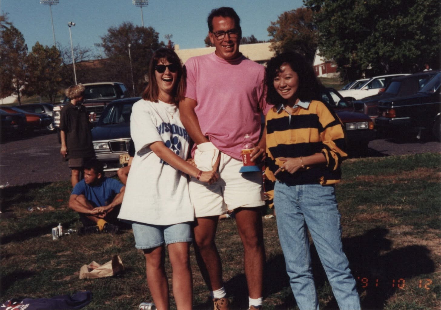 Ramona Sparks Hicks and Rob Rasnic beside parked cars after the match