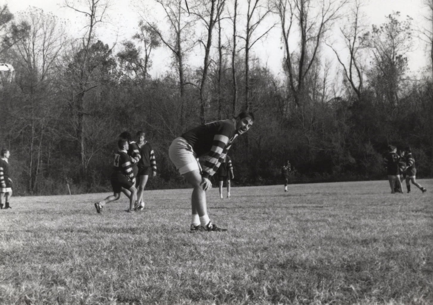 Colin Schmidt leaps to take the ball in a lineout, black and white photograph