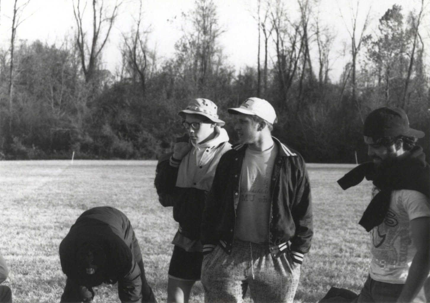John Tajkowski and Rob Hoens with teammates on the touchline, black and white photograph